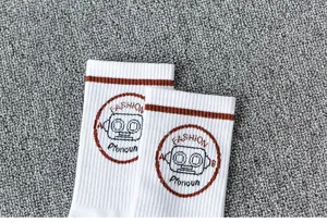 Street style white cotton mid-tube socks for men and women, featuring cool robot print.