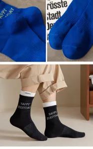 Men's cotton mid-tube socks featuring a side label and double-layer ribbed cuff design.