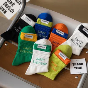 Colorful crew socks for men and women, stylish double-layer cuff design with woven label.