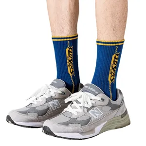 Street mid-calf socks for men, blue and yellow striped trendy hip-hop cotton sports socks.