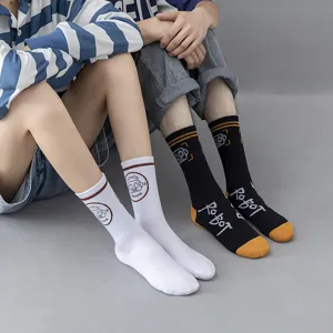 Unisex streetwear cotton mid-calf socks with cool robot graphic embroidery, black and white.