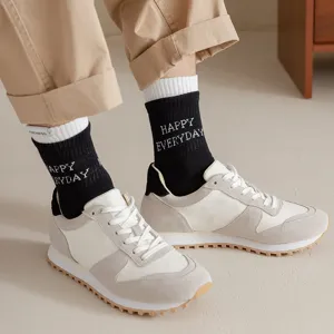 Men mid-tube cotton socks with stylish side label and knit lettering for casual daily wear.