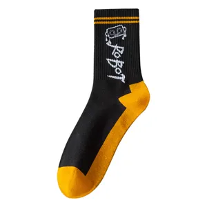 Black and yellow cotton mid-calf socks with cool robot graphic for trendy streetwear.