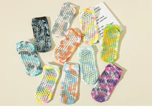 Colorful tie-dye non-slip yoga socks with grip dots, perfect for pilates, fitness, and home wear.
