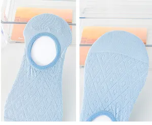 Detailed close-up of light blue shallow-mouth invisible boat socks featuring breathable mesh.