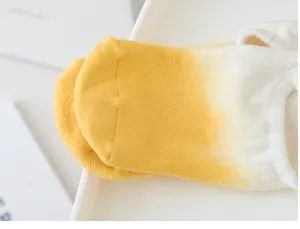 Close-up detail shot of gradient tie-dye yoga pilates socks showing breathable knit fabric.