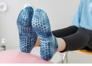 Tie-dye pilates grip socks with non-slip hexagonal soles for yoga and fitness training.
