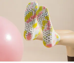 Tie dye pilates grip socks for women, non slip cotton yoga socks with grey dots detail.