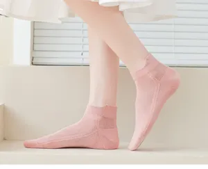 Close-up detail of breathable pink mesh low-cut socks, featuring lightweight summer fabric design.