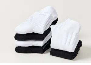 Men's athletic sport socks detail view showcasing breathable cotton fabric and neat stacking.