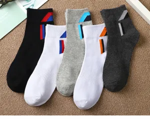 Men's mid-tube athletic socks with breathable cotton fabric and stylish diagonal color block design.