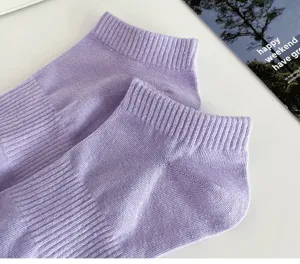 Close up detail of women solid color lavender short ankle socks with soft ribbed cuff.