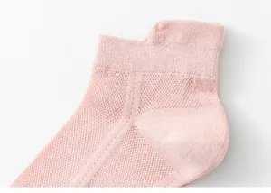 Close-up view of pink women's breathable mesh ankle socks showing fine knit detail.