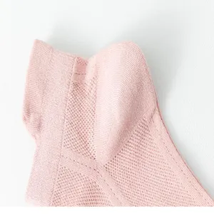 Close-up detail of women's pink breathable mesh short socks, lightweight hollow knit design.