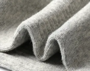 Detailed view of soft grey heather knit cotton fabric, showing breathable texture and quality.