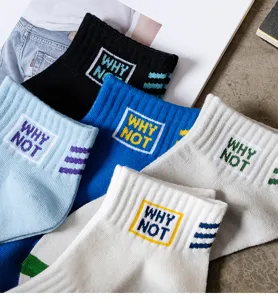 Men's short socks detail, colorful cotton boat socks with embroidered slogan and stripes.