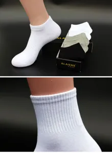 Detail view of men's casual crew and ankle sports socks featuring soft ribbed cotton fabric.