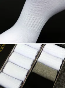Men's solid color cotton mid-tube socks detail view, featuring ribbed knit design and fit.