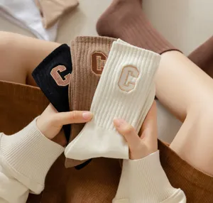 Cotton collegiate style crew socks with embroidered letter C design for women autumn winter.