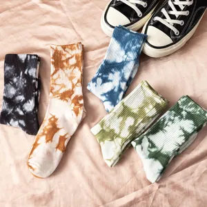 Trendy tie-dye mid-calf socks for women and men, stylish street style casual wear.
