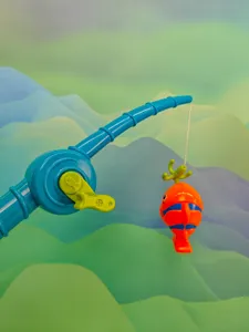 Detailed shot of children bath fishing toy set, featuring blue rod and cute orange fish hanging.