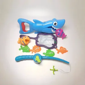 Kids bath toy set featuring blue shark grabber, fishing rod, net and colorful fish for water play.
