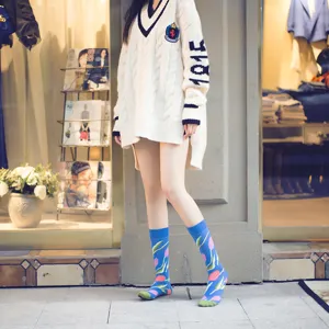 Trendy women men long cotton socks with stylish blue tulip floral pattern street style.