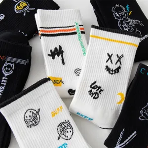 Unisex trendy mid-calf cotton socks with graffiti and smiley face prints for streetwear.
