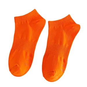 Women's bright orange low-cut socks, comfortable cotton ankle socks with anti-slip grip.