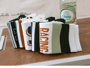 Men fashion athletic mid-tube socks with contrast stripes and racing letters for sports.