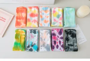 Detailed closeup of colorful tie-dye non-slip yoga socks, perfect for pilates and fitness sports.