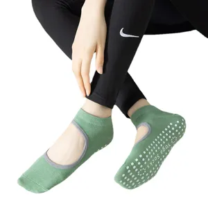 Women non-slip yoga socks with grip soles and cut-out design for pilates, fitness and gym.