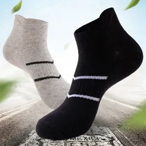 Athletic short socks in black and grey, breathable and comfortable fabric detail.