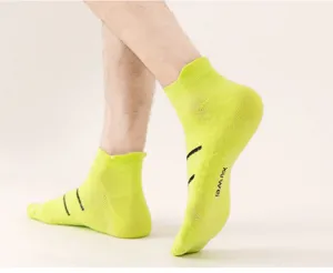Fluorescent green men's athletic short socks, breathable mesh detail, close-up view.