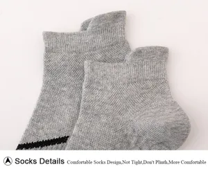 Men short ankle socks detail, grey breathable athletic socks with a black stripe design.