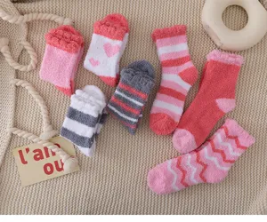 Cozy fuzzy coral fleece socks for women, thick winter warm thermal sleep socks, cute pink striped design.