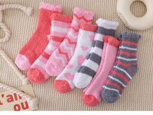 Cozy fuzzy coral fleece socks for women, thick winter warm thermal crew socks with cute hearts.