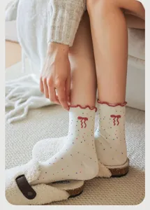 Cute Japanese style women mid-calf socks featuring colorful dots and sweet bowknot design.