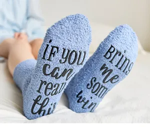 Cozy light blue fuzzy floor socks with funny anti-slip text print, warm winter coral fleece detail.