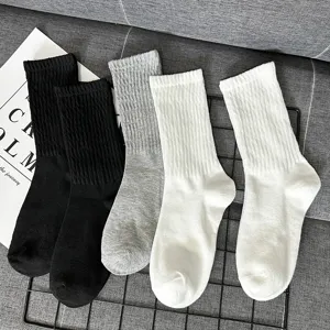Classic cotton mid-tube socks in black, grey and white, comfortable for daily wear.