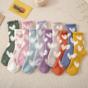 Cozy fuzzy winter socks for women with cute heart patterns, thick warm sleep socks for home use.