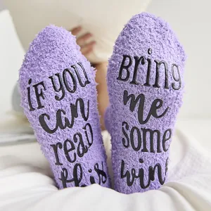 Cozy winter fuzzy floor socks for women with funny letter print, warm coral fleece anti-slip socks.