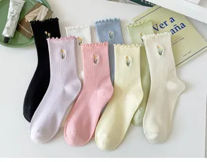 Ruffled mid-tube women's socks with cute tulip embroidery in assorted pastel colors.