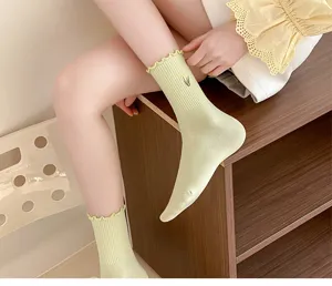 Cute ruffle trim mid-tube socks with sweet tulip embroidery for spring and summer daily wear.