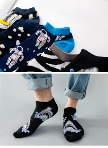 Detailed close-up of trendy cotton socks featuring fun cartoon astronaut and shark patterns.