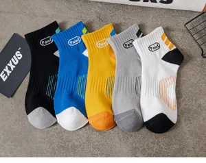 Detail view of men's short cotton socks in vibrant colors with stylish letter prints.