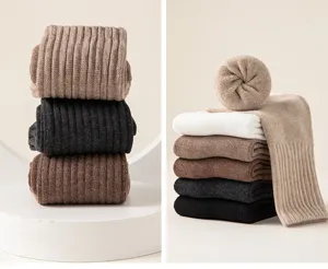 Close-up detail of thick fleece-lined winter socks, featuring ribbed knit design in various colors.