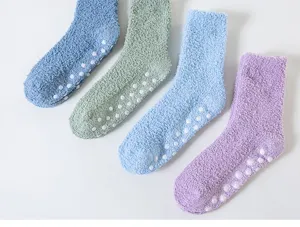 Detailed view of thick fuzzy coral fleece home socks with anti-slip dots for cozy winter floor wear.
