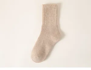 Close-up detail of a soft beige ribbed crew sock, perfect for autumn and winter daily wear.