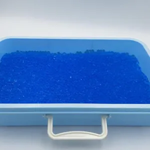 Colorful expanding water gel beads toy in a blue portable storage box for kids fun.